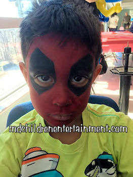 Face painting for boys, deadpool design. Offering face painting services in Toronto, Newmarket, Barrie, Markham and the gta.