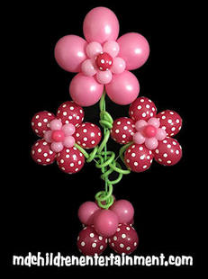 Balloon decoration with 3 big flowers. Hire us to decorate parties in Toronto, Markham, Newmarket, Barrie and surrounding areas.