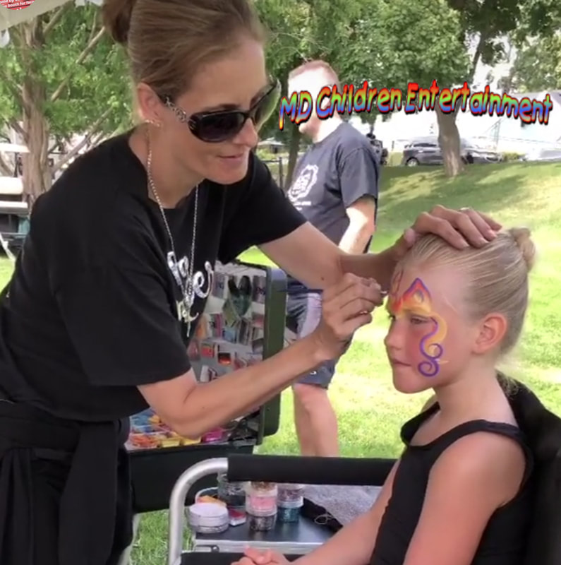 Face painter Tanya busy with face painting! Toronto, Ontario!