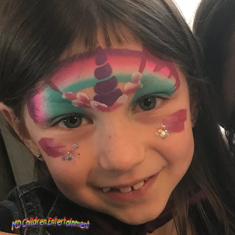 Unicorn butterfly face painting by Tanya. Toronto, Vaughan, Newmarket, Bradford and more gta areas!