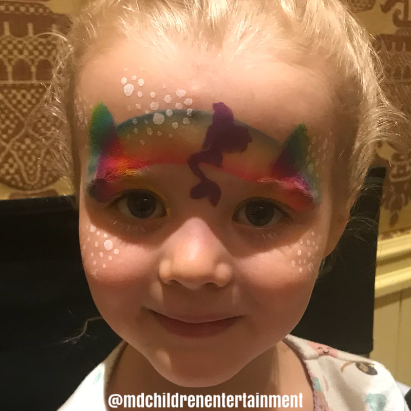 She asked for no sparkles! Mermaid rainbow face paint. Muskoka, Barrie, Newmarket, Bradford, Markham, Toronto and gta