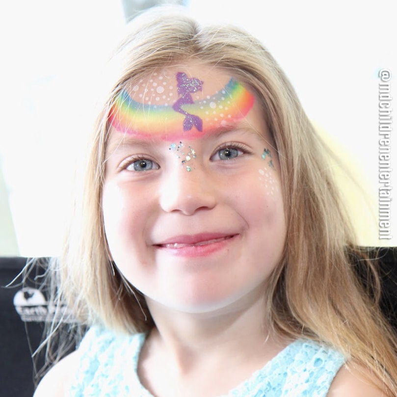 Rainbow with mermaid face painting, also including chunky glitter! Toronto and gta!