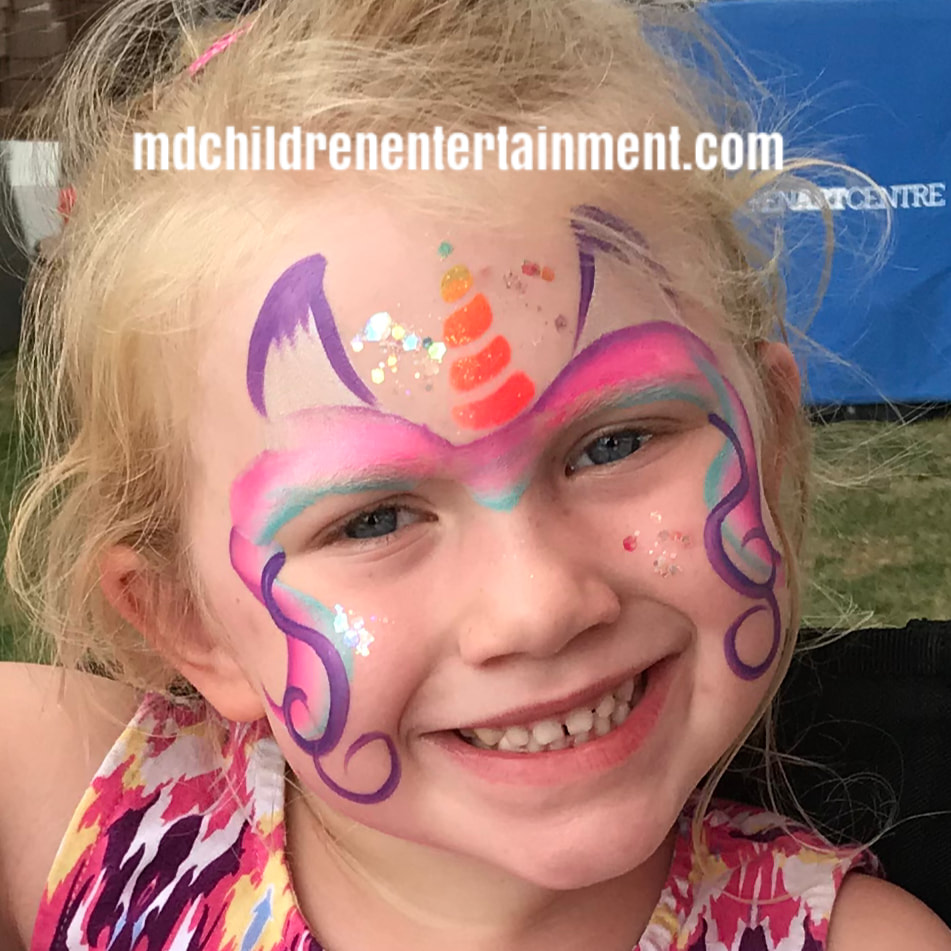 A beautiful unicorn face painted girl! We offer fantastic face painting services for children's entertainment.